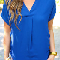 A timeless wardrobe essential, the Whitney Woven Blouse is crafted from a lightweight, soft woven fabric that drapes luxuriously over the body. Cut with a modern v-neckline and cuffed short sleeves, it makes an effortlessly chic addition to any wardrobe.

Fabric: 100% Polyester