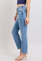 Judy Blue mid-rise vintage wash slim jeans featuring a cell phone pocket, non-destroy design, and versatile cuffed or uncuffed styling for a timeless look.
