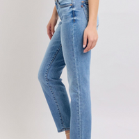 Judy Blue mid-rise vintage wash slim jeans featuring a cell phone pocket, non-destroy design, and versatile cuffed or uncuffed styling for a timeless look.