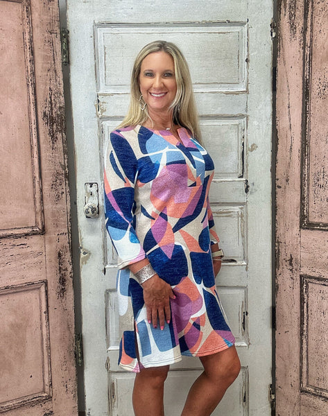 Step into effortless style with the Julie Split Neck Dress, featuring a stunning sunset mosaic print that captures vibrant, warm tones perfect for any occasion. Crafted from a comfortable and breathable blend of 85% polyester, 10% viscose, and 5% spandex, this dress offers just the right amount of stretch and flow for all-day wear.