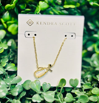 Kendra Scott Golf gold short pendant necklace with golf bag-inspired pendant and metallic club detailing.

Kendra Scott necklace, golf pendant necklace, gold golf jewelry, sporty gold necklace, women’s golf accessory, Sweet Southern Charm Kendra Scott