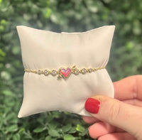 Ari Heart Gold Arrow Tennis Bracelet in Pink Opalescent Resin
Kendra Scott Bracelet 
Heart Bracelet 
tennis bracelet 
Valentines jewelry 
Trendy 
Kendra Scott

