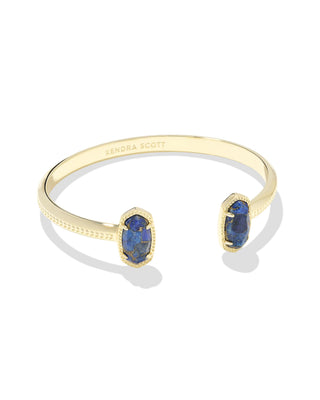 Style | Dainty pinch cuff with signature oval stone stations

Metal | 14k yellow gold over brass

Stone | Bronze-veined blue lapis

Fit | Adjustable cuff

Size | 2.28-inch inner diameter; 0.67-inch L x 0.38-inch W