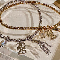 2025 Gold Graduation Stretch Bracelet in Dichroic Glass