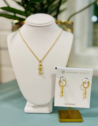 Kendra Scott gold seahorse short pendant necklace on delicate chain, seaside-inspired coastal jewelry
Kendra Scott gold seahorse huggie earrings.