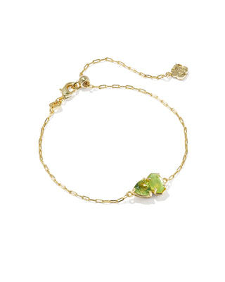 Brand | Kendra Scott
Style | Delicate Chain Bracelet
Design | Signature Elisa shape with a trillion-cut stone in August birthstone-inspired shades, a toi et moi ("you and me") style
Colorway | Light Green Mix
Metal | 14k Yellow Gold Over Brass
Closure | Lobster clasp with a single adjustable slider bead
Size | 8" inner circumference, 0.36" wide