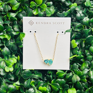 Tatum Gold Short Pendant Necklace featuring Elisa shape and trillion-cut December birthstone-inspired stone (blue mix color stone) on delicate gold chain.