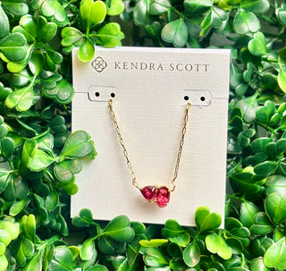 Tatum Gold Short Pendant Necklace with Elisa shape and trillion-cut January birthstone-inspired stone (burgundy color stone) on delicate gold chain.