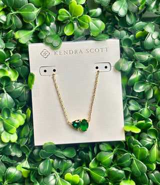Tatum Gold Short Pendant Necklace featuring Elisa shape and trillion-cut May birthstone-inspired stone (dark green color stone) on delicate gold chain.