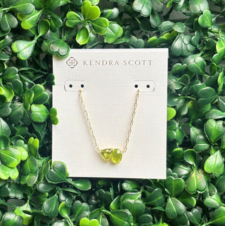 Tatum Gold Short Pendant Necklace featuring Elisa shape and trillion-cut August birthstone-inspired stone (green mix color stone) on delicate gold chain.