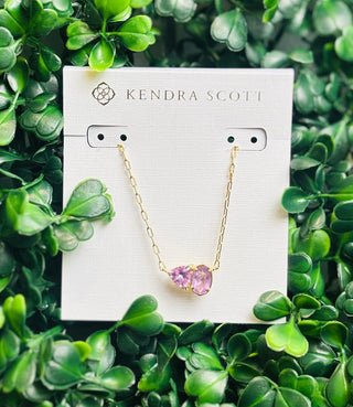 Tatum Gold Short Pendant Necklace featuring Elisa shape and trillion-cut February birthstone-inspired stone (purple color stone) on delicate gold chain.