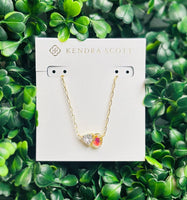 Tatum Gold Short Pendant Necklace featuring Elisa shape and trillion-cut April birthstone-inspired stone (Dichroic glass stone/clear crystal stone) on delicate gold chain.
