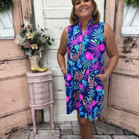 Stay stylish and protected with this sleeveless dress featuring a split neckline and UPF50+ fabric, perfect for any outdoor adventure.