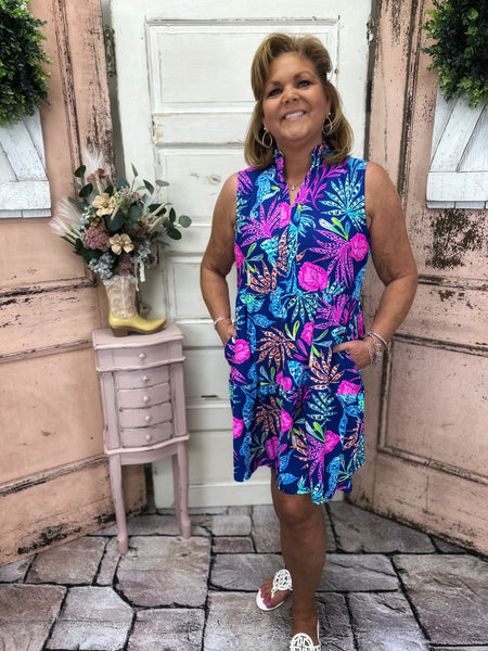 Stay stylish and protected with this sleeveless dress featuring a split neckline and UPF50+ fabric, perfect for any outdoor adventure.