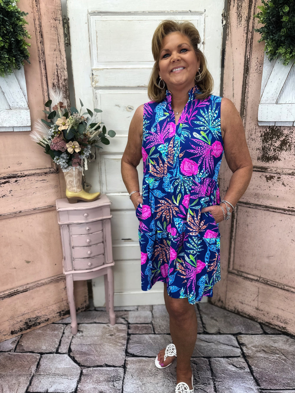 Stay stylish and protected with this sleeveless dress featuring a split neckline and UPF50+ fabric, perfect for any outdoor adventure.