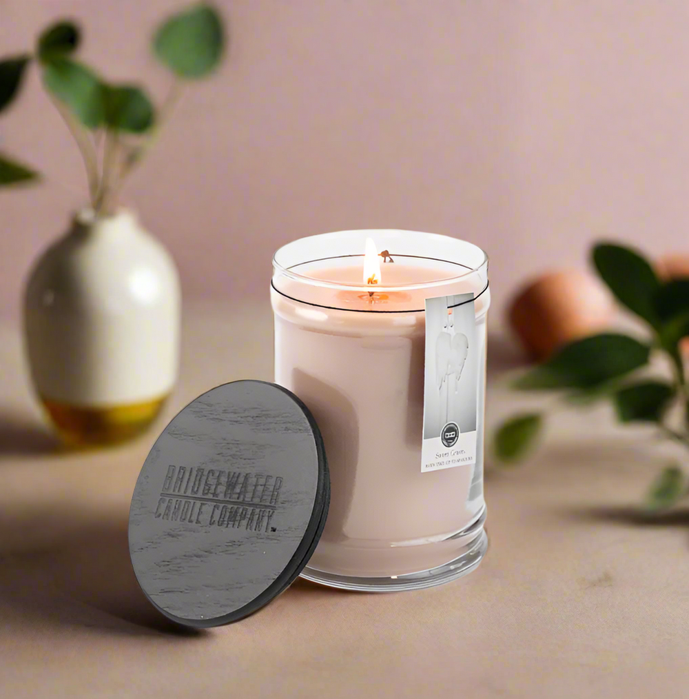 Our original 18oz Large Jar Candle is the perfect way to enjoy your favorite Bridgewater fragrance. This timeless glass jar includes a black wooden lid and a hangtag that features a picture of a child who is supported through our LIGHT A CANDLE · FEED A CHILD program.

Fragrance: Sweet Grace
Fragrance Family: Oriental & Spice
Fragrance Description: With exotic passion fruit, sparkling tea and classic patchouli, Sweet Grace is undeniably warm, peaceful and pure.
