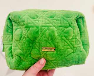 Peninsula Green quilted fabric and gold bamboo zipper pulls. The outside is stain-resistant and easy to clean so it will hold up trip after trip.