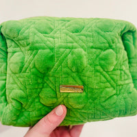 Peninsula Green quilted fabric and gold bamboo zipper pulls. The outside is stain-resistant and easy to clean so it will hold up trip after trip.