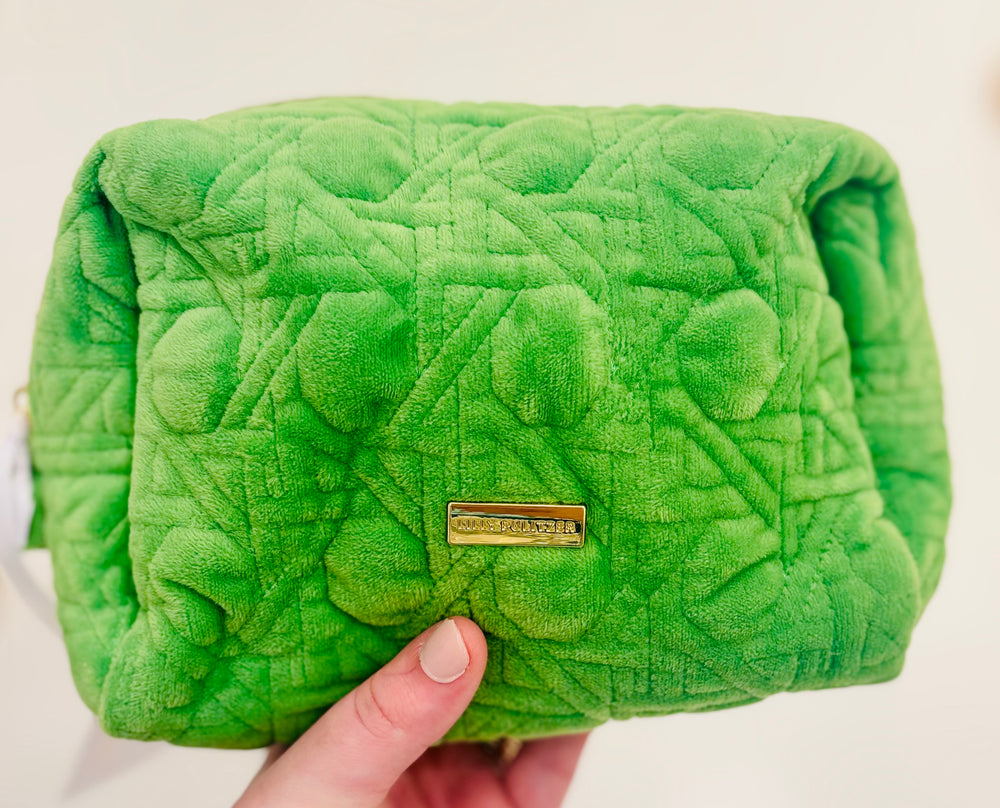 Peninsula Green quilted fabric and gold bamboo zipper pulls. The outside is stain-resistant and easy to clean so it will hold up trip after trip.
