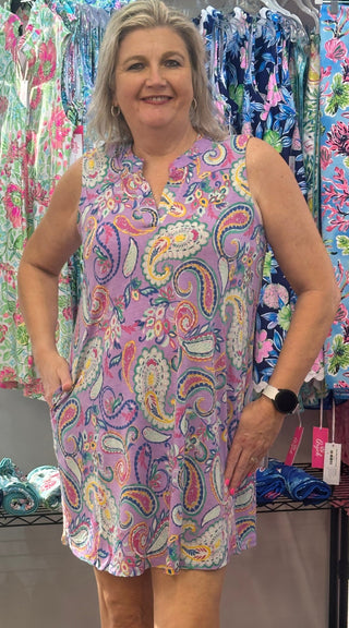 Soft color, effortless style. This Dear Scarlett Lizzy tank dress features an A-line bodice with a mandarin collar and pleated back detail — a silhouette that flatters and flows in equal measure. Non-sheer, wrinkle-free, and knit for all-day comfort.