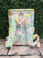 Insulated cooler tote in Lilly Garden Home print with adjustable straps and front zipper pocket, perfect for carrying snacks, drinks, and sunscreen outdoors.
