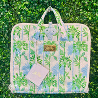 Stay organized and chic on your next getaway with the Lilly Pulitzer Swayin’ in the Breeze Hanging Toiletry Bag. Inspired by coastal breezes, this bag features a durable coated canvas exterior that’s easy to clean, making it perfect for beach trips, weekend retreats, or everyday travel.

Inside, a thoughtfully designed layout includes two interior PVC slip pockets, one mesh zip pocket, and a spacious main compartment with two additional mesh pockets, keeping all your essentials perfectly organized.