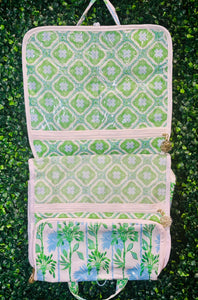 Stay organized and chic on your next getaway with the Lilly Pulitzer Swayin’ in the Breeze Hanging Toiletry Bag. Inspired by coastal breezes, this bag features a durable coated canvas exterior that’s easy to clean, making it perfect for beach trips, weekend retreats, or everyday travel.

Inside, a thoughtfully designed layout includes two interior PVC slip pockets, one mesh zip pocket, and a spacious main compartment with two additional mesh pockets, keeping all your essentials perfectly organized.