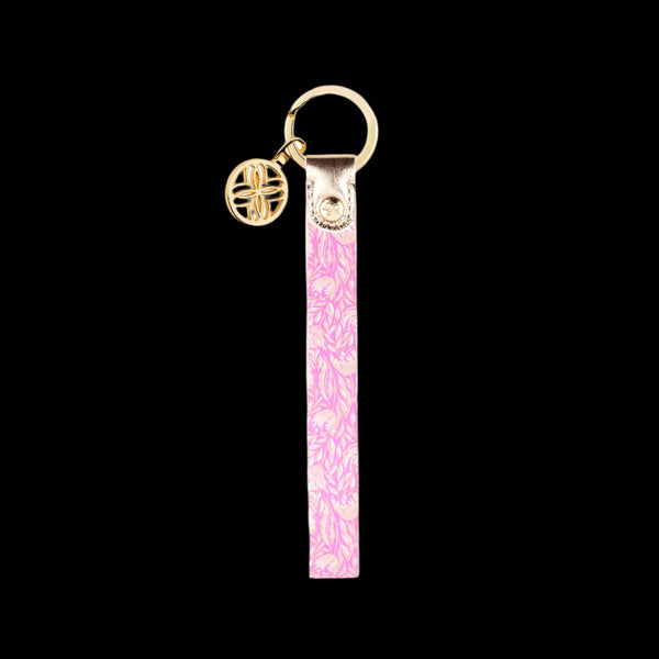 Lilly Pulitzer Tulip to Tango strap keychain with a vibrant two-sided design, gold hardware, and a hands-free bracelet style for convenience and flair.