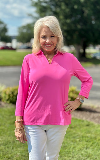 The Lulu-B 3/4 Sleeve Collar Top in Bright Hot Pink brings a head-turning pop of color to any warm-weather look — a classic foldover polo collar, 3/4 sleeves, straight hemline, and subtle 1-inch side slits for easy movement give it a polished yet relaxed silhouette that works effortlessly from a morning walk to a dressed-up afternoon out. 