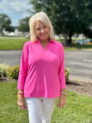  The Lulu-B 3/4 Sleeve Collar Top in Bright Hot Pink brings a head-turning pop of color to any warm-weather look — a classic foldover polo collar, 3/4 sleeves, straight hemline, and subtle 1-inch side slits for easy movement give it a polished yet relaxed silhouette that works effortlessly from a morning walk to a dressed-up afternoon out. 