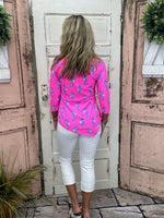 Lulu-B Asymmetrical Top in Seahorse Hot Pink with UPF 50 fabric, scoop neckline, 3/4 sleeves, and a stylish asymmetrical hemline. Comfortable & pre-shrunk.
