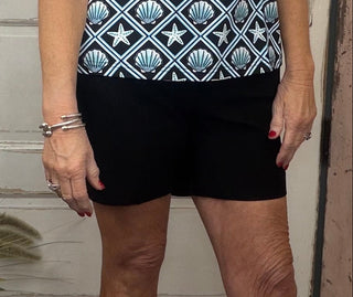 The Lulu-B Bangladine Pull-On Shorts are a warm-weather essential designed for comfort, ease, and polished style. Made from Lulu-B’s signature bangladine fabric, these shorts offer a smooth, structured feel with comfortable stretch. The pull-on waistband creates an easy, flattering fit, while subtle side vents add movement and a modern touch. Lightweight and travel-friendly, these shorts are perfect for everyday wear, vacations, and sunny days on the go.