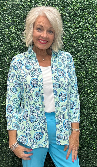 Fabric | 92% Nylon / 8% Spandex, crinkle texture
UPF | 50+ sun protection
Silhouette | Long sleeve button blouse, relaxed fit
Collar | Pointed foldover
Shoulders | Drop shoulder
Hemline | Curved
Detail | Center seam; mint gingham with allover seashell print (GISB)
Length | 28" center back