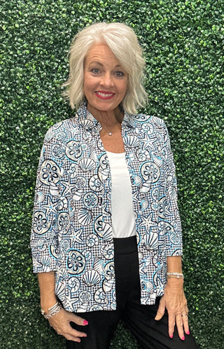 Fabric | 92% Nylon / 8% Spandex, crinkle texture
UPF | 50+ sun protection
Silhouette | Long sleeve button blouse, relaxed fit
Collar | Pointed foldover
Shoulders | Drop shoulder
Hemline | Curved
Detail | Center seam; black and white gingham with allover coastal seashell print (GISN)
Length | 28" center back
