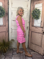 Feminine, flattering, and sun-safe! This best-selling sleeveless dress features charming ruffles on the front and back, a scoop neckline, and a straight hemline. Crafted from a soft 92% Nylon / 8% Spandex blend, it offers a comfortable, stretchy fit that flatters all shapes and sizes. With UPF50 sun protection and a 30.5" length, it’s perfect for sunny days, travel, or everyday wear. Pre-shrunk for a lasting fit—just machine wash and hang dry for easy care!
