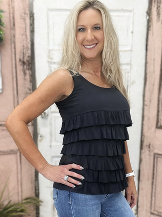 The Lulu-B Cha Cha Tank is crafted from soft, stretchy fabric with front and back ruffles that add a playful, flirty touch to any outfit — whether you're dressing it up for a night out or keeping it casual for a warm summer day.

Featured in solid color Black