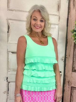Turn heads with the flirty and fun Cha Cha Tank! Designed with soft, stretchy fabric and UPF50 protection, this feminine favorite features front and back ruffles, a scoop neckline, and a straight hemline at the waist. At 30.5" long, it pairs perfectly with any bottoms for effortless summer style. Machine washable and hang dry for easy care—add a little cha cha to your wardrobe today!