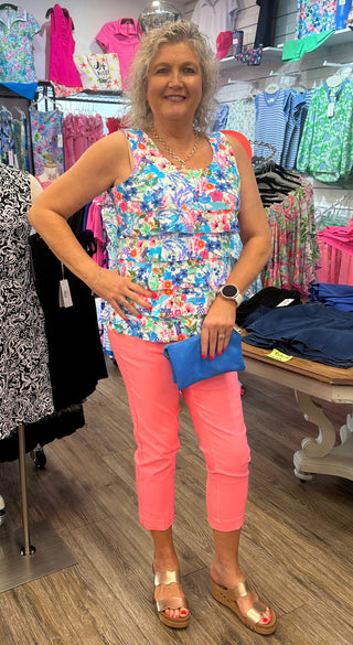 Flirty, feminine, and made for sunny adventures. The Lulu-B Cha Cha Tank in MCDR features a beautiful tropical floral and water scene with charming dragonfly details — front and back ruffles, a scoop neckline, and a straight hemline give it a playful, resort-inspired silhouette that pairs effortlessly with any bottom for an effortless warm-weather look. Soft, stretchy fabric with UPF 50 protection and a 30.5" length make it as practical as it is pretty, whether you're at the beach, out for brunch, or soakin