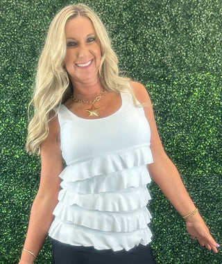 The Lulu-B Cha Cha Tank in White is crafted from soft, stretchy fabric with front and back ruffles that add a playful, elevated touch — that clean white hue makes it one of the most effortless pieces in your warm-weather wardrobe, pairing beautifully with virtually everything you own