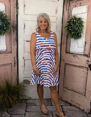 The Cha Cha Dress features front & back ruffles, UPF 50+ protection, and a stretchy 92% nylon blend. 30.5" length, machine washable. Flattering for all sizes.