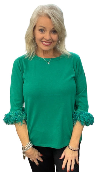 Elevate your everyday style with the Lulu-B FX Cashmere Scoop Neck Sweater Top. Luxuriously soft and lightweight, this must-have piece combines comfort with chic detail. The scoop neckline flatters every figure, while playful fringe on the elbow-length sleeves adds just the right touch of charm. Dress it up with slacks for work or pair with jeans for a polished casual look—you’ll love how effortlessly versatile it is.