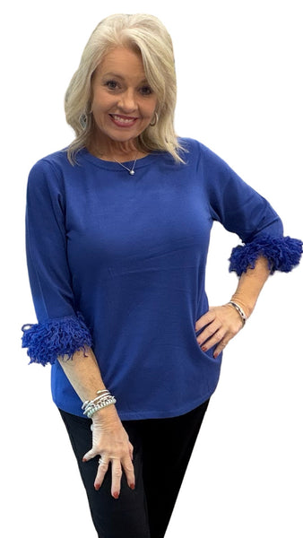 Elevate your everyday style with the Lulu-B FX Cashmere Scoop Neck Sweater Top. Luxuriously soft and lightweight, this must-have piece combines comfort with chic detail. The scoop neckline flatters every figure, while playful fringe on the elbow-length sleeves adds just the right touch of charm. Dress it up with slacks for work or pair with jeans for a polished casual look—you’ll love how effortlessly versatile it is.