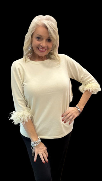 Elevate your everyday style with the Lulu-B FX Cashmere Scoop Neck Sweater Top. Luxuriously soft and lightweight, this must-have piece combines comfort with chic detail. The scoop neckline flatters every figure, while playful fringe on the elbow-length sleeves adds just the right touch of charm. Dress it up with slacks for work or pair with jeans for a polished casual look—you’ll love how effortlessly versatile it is.
