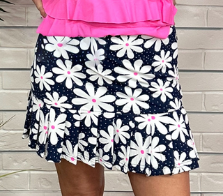 The Lulu-B Flounce Skort in the Daisy print features a bold black background with white daisies and hot pink centers — a fun, eye-catching print that pairs effortlessly with your favorite warm-weather tops. The single ruffle hem detail adds a flirty, flouncy finish that makes this skort anything but ordinary.
