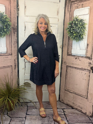 Bright, flattering, and effortlessly comfortable, the Lulu-B Half Zip Dress is a go-to for sunny days and casual-chic outings. Crafted from a textured performance fabric, this dress offers lightweight comfort with a polished look that doesn’t cling. The half-zip neckline adds sporty versatility, while the easy silhouette makes it perfect for everything from travel and errands to lunch dates and resort wear. Stylish yet practical, this Lulu-B favorite is one you’ll reach for again and again.