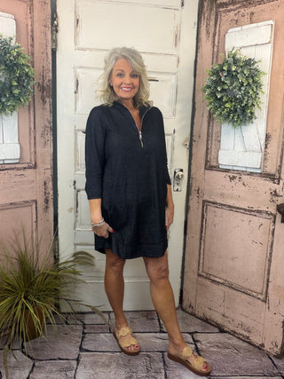Bright, flattering, and effortlessly comfortable, the Lulu-B Half Zip Dress is a go-to for sunny days and casual-chic outings. Crafted from a textured performance fabric, this dress offers lightweight comfort with a polished look that doesn’t cling. The half-zip neckline adds sporty versatility, while the easy silhouette makes it perfect for everything from travel and errands to lunch dates and resort wear. Stylish yet practical, this Lulu-B favorite is one you’ll reach for again and again.