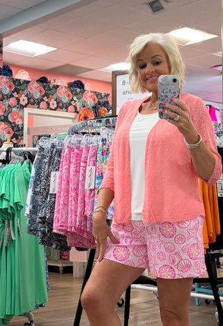 The Lulu-B Textured Cardigan Coral— lightweight woven texture, airy arm coverage, bold color. A vibrant layering piece for warm-weather style.