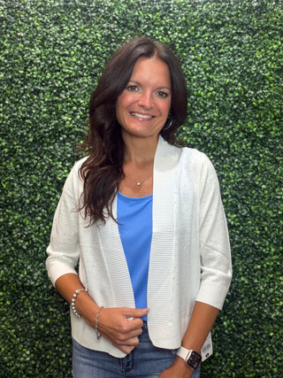 Lulu-B Rhinestone Cardigan – White
Fresh, luminous, and effortlessly polished. Lulu-B's Rhinestone Cardigan in White is the kind of layer that makes everything feel more intentional — scattered rhinestone details shimmer beautifully against the crisp white knit, creating a look that's equally at home at a summer brunch or a seaside dinner.