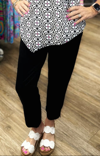 The Lulu-B Secret Pocket Capri in Black is crafted from breathable, cooling fabric with UPF 50 protection — that classic black colorway pairs effortlessly with every top, print, and color in your wardrobe, while the flattering 25" inseam and hidden pocket detail make these as practical as they are stylish.