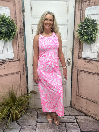 Unleash your inner goddess with our Sexy Maxi Dress! This dress features a cutout back that adds a touch of allure and a straight fit that flatters your figure. Made with UPF50 sun protection fabric, you can confidently soak up the sun while looking fabulous.

features a Pink/White Hawaiian Floral Print